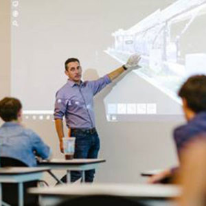 A Clark Nexsen Architecture & Engineering Firm employee instructs Grassfield High School (Virginia) students