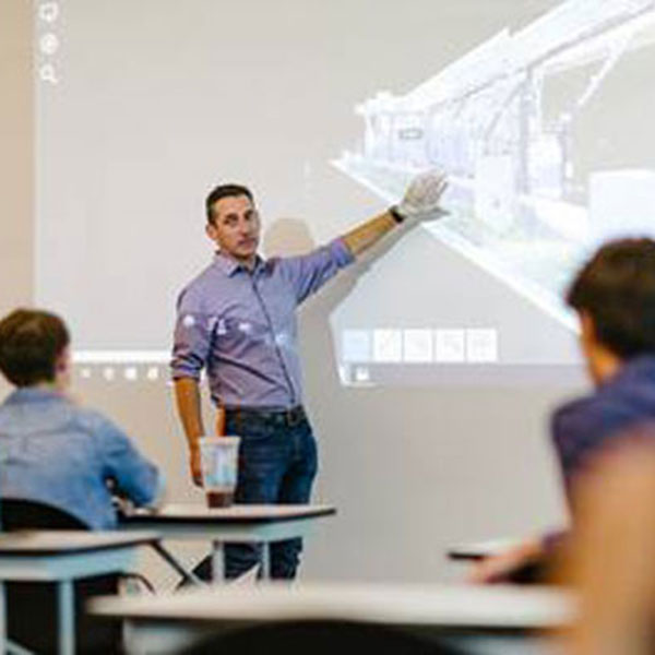 A Clark Nexsen Architecture & Engineering Firm employee instructs Grassfield High School (Virginia) students