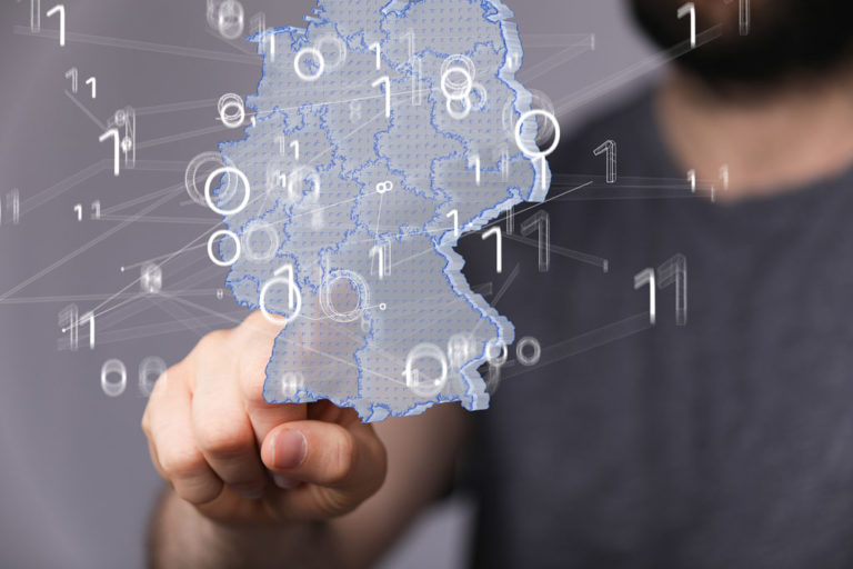 Photo illustration of person pointing at map boundary with overlay of numbers