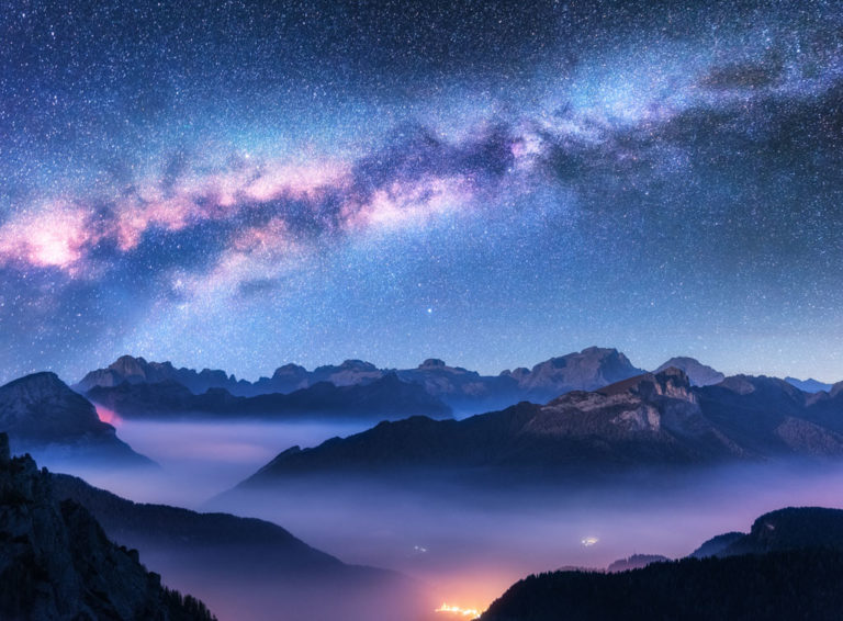 shutterstock_1290018820 purple mountains mist night stars sky