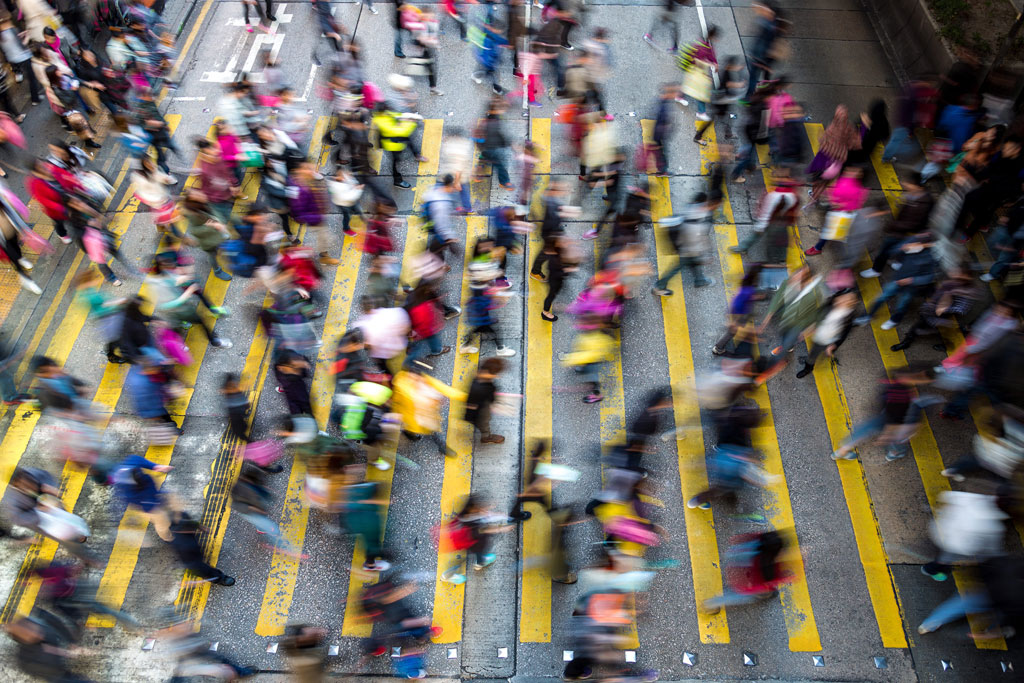 Movement of people crossing a busy intersection