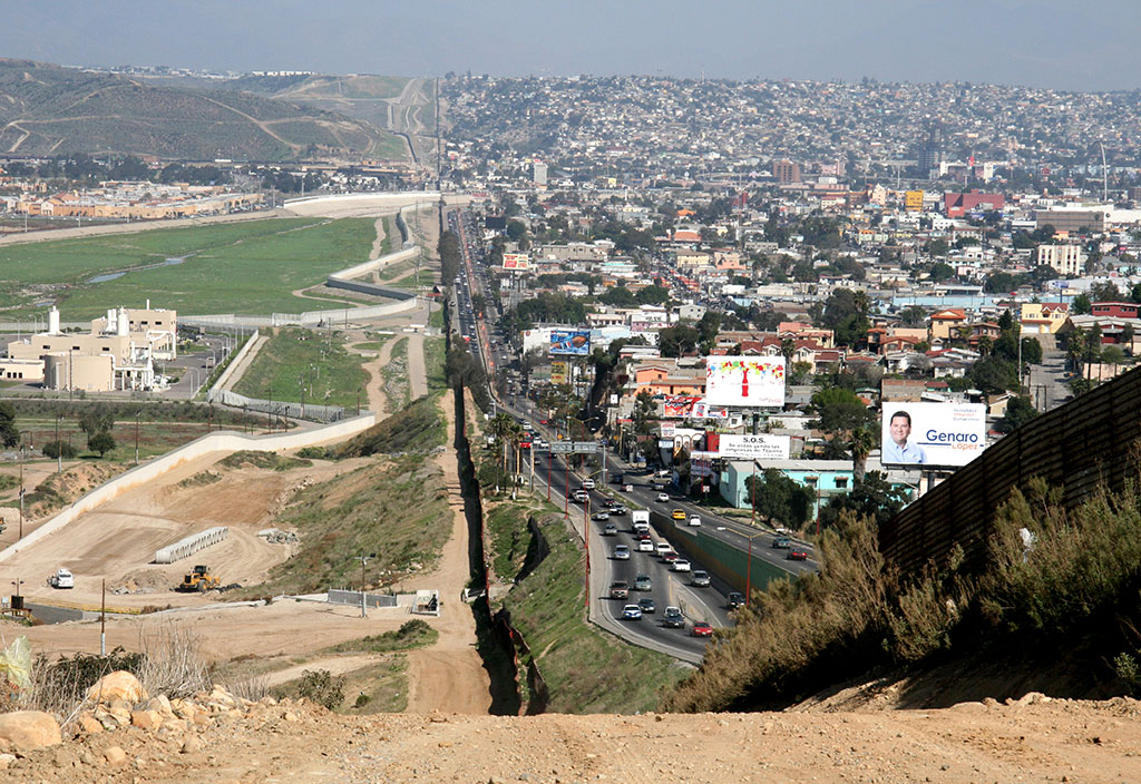 In 2007 a fence separated densely populated Tijuana, Mexico, right, from the United States in the Border Patrol’s San Diego Sector; credit Sgt. 1st Class Gordon Hyde, U.S. Army