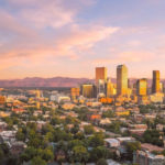 Aerial view of downtown Denver with mountains in the background; credit: CANUSA Touristik Source: https://www.denver.org/media/photo-video-requests/ (Instagram feed)