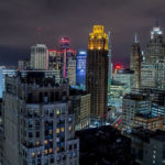 Night-time skyline image of glowing city of Detroit by Derek Gauci, CC BY-SA 4.0