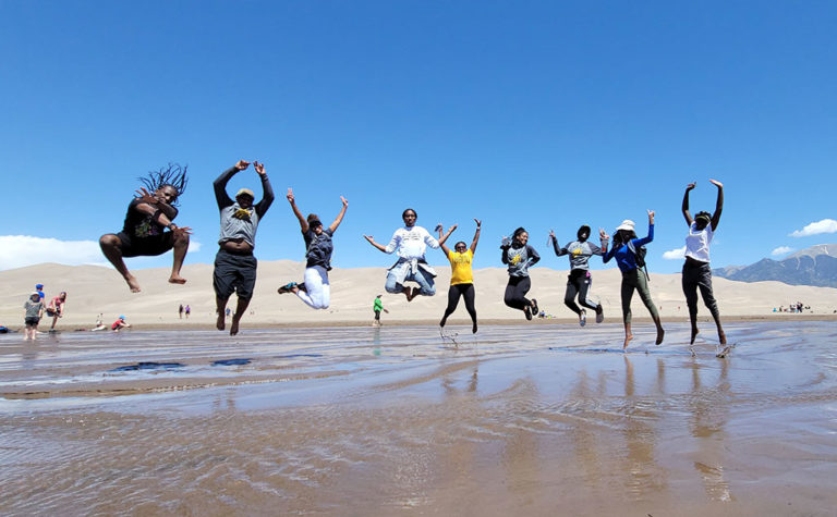 Bowie State University Professor Sumanth Reddy captures nine of his students in an action pose as they explore Great Sand Dunes National Park in Colorado. Credit: Sumanth Reddy