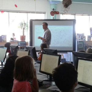 Photo of Brian Kaplan instructing students in a classroom