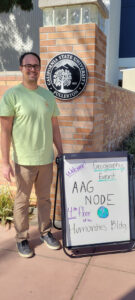 A directional sign welcomes attendees to the Humanities and Social Sciences building during the California State University, Fullerton AAG 2023 node events.