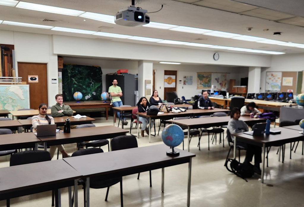 Attendees listen to a streamed session during the California State University, Fullerton AAG 2023 node events.