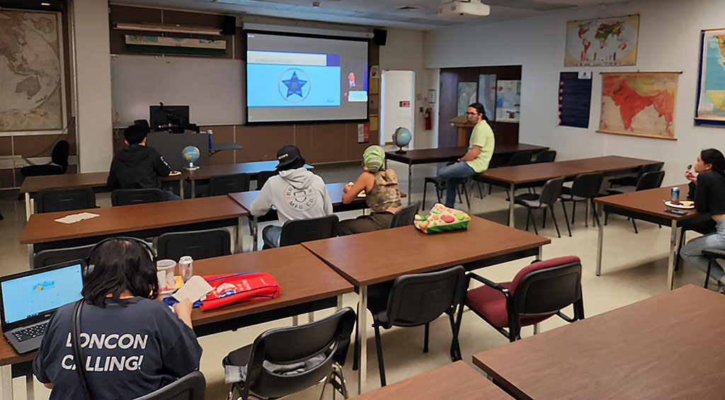 Attendees listen to Gary Langham's introduction about AAG's strategic plan during a streamed session at the California State University, Fullerton AAG 2023 node of events.