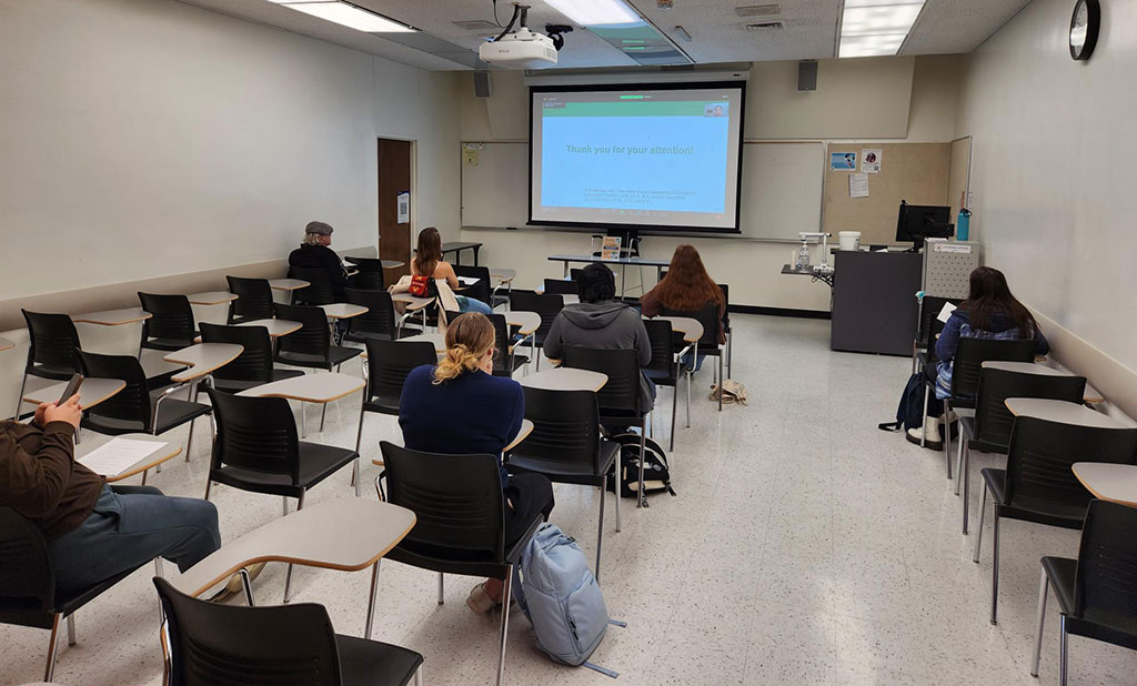 Attendees listen to a streamed session during the California State University, Fullerton AAG 2023 node events.