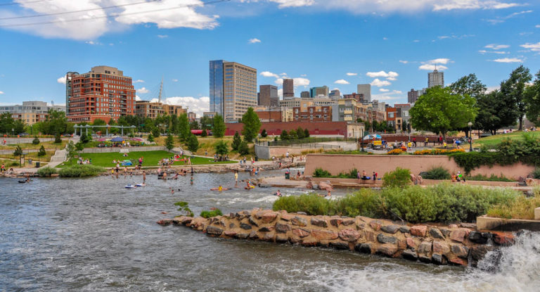 Confluence Park rapids and beach with a backdrop of the Denver Skyline by Kent Kanouse, Creative Commons