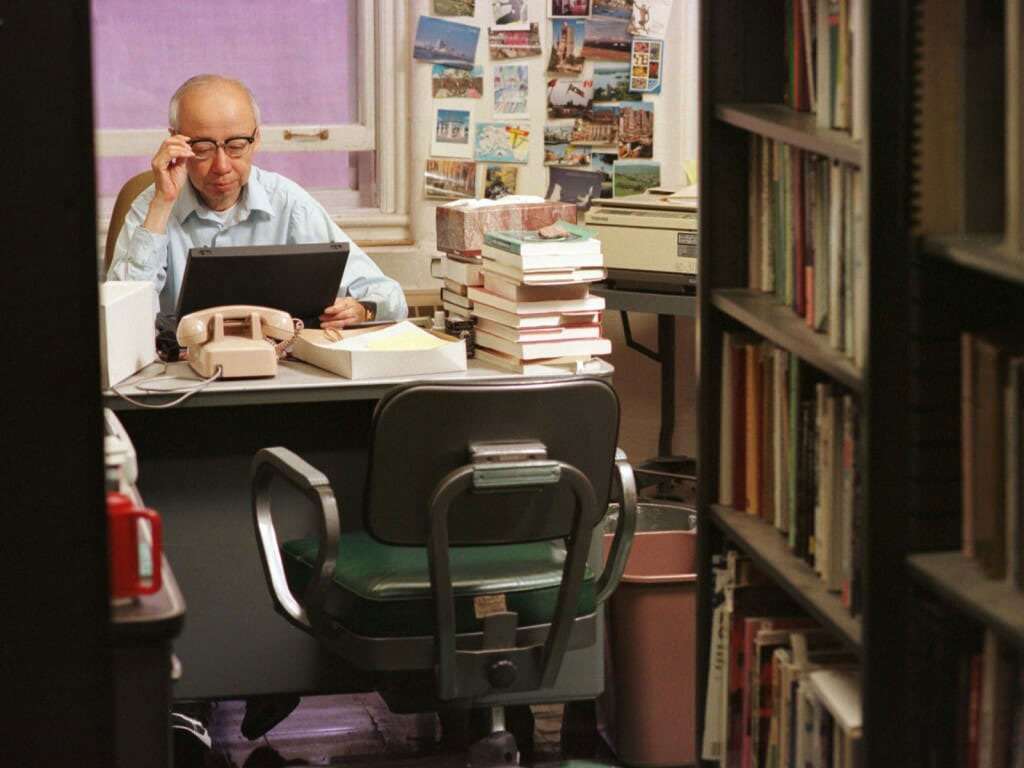 Yi-Fu Tuan at work in his Science Hall office in 1998. Tuan was a prolific writer. Photo by Jeff Miller