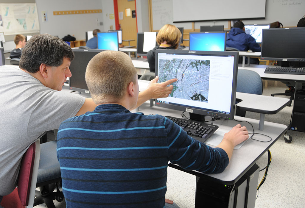 Photo of students in a Salisbury University GIS class demonstrating mapping on their computers