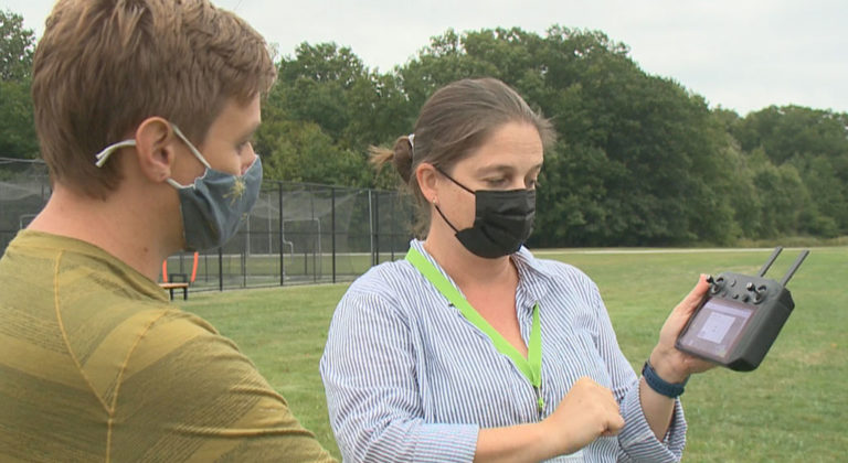 Photo of geography students receiving instruction on UAS operation during a class lab. Credit: Bobby Oliver