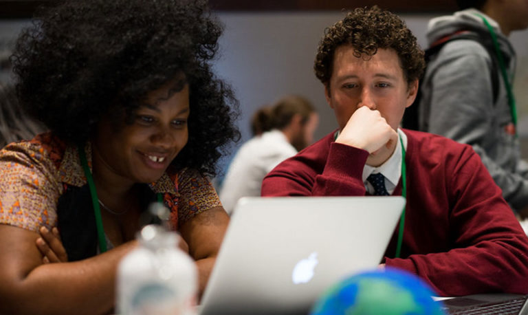 Geographers participate during a MapGive open mapping event for humanitarian aid. Credit: U.S. Department of State