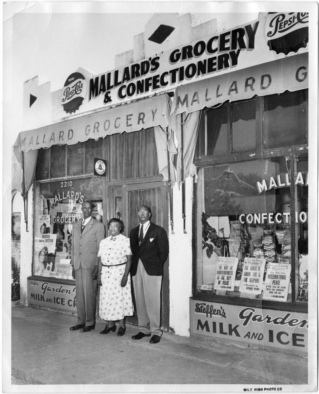 Photo of David and Virginia Mallard in front of their store, circa 1948, with an unidentified man. Credit: Denver Public Library Special Collections