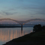 Photograph entitled "Volunteer Bridge" by Tyre Nichols; the image shows the Hernando De Soto Bridge lit up in the evening in Memphis, Tennessee