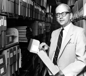 Photo of William Koelsch in the stacks of Goddard Library at Clark University