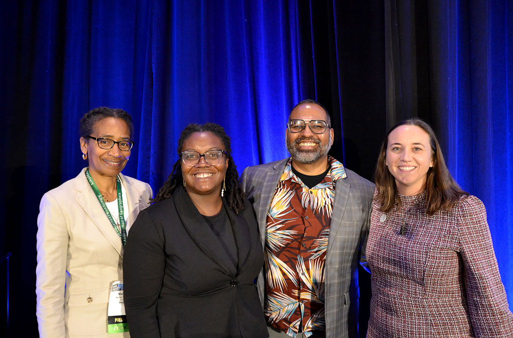 Marilyn Raphael and her panelists Tianna Bruno, Guillermo Douglass-Jaimes and Kelly Kay posed for a photo after the 2023 AAG Presidential Plenary, Toward More Just Geographies. Credit: Becky Pendergast, AAG