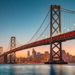 San Francisco skyline with Oakland Bay Bridge at sunset