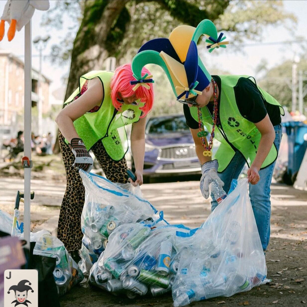 Grant Rodriguez Almani and a colleague participate in a recycling cleanup while dressed in humorous costumes. Credit: Katie Sikora 