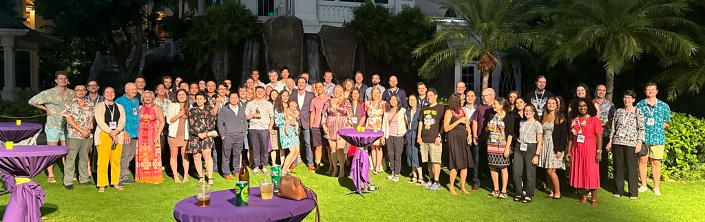 Attendees from the Symposium on Hurricane Risk gather for a group photo outside for the closing reception. Credit: Jennifer Colins