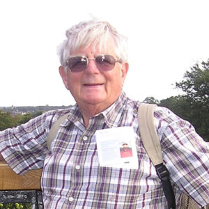 Julian Minghi posed for a photo outdoors