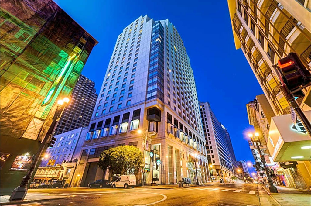 Street-level view of Hotel Nikko in San Francisco at dusk; courtesy Hotel Nikko