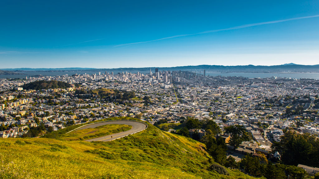 View of San Francisco from Twin Peaks showing the city skyline wrapping around several hills