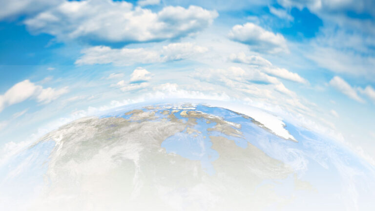 Blue sky and clouds encircle the top half of North America and the Arctic