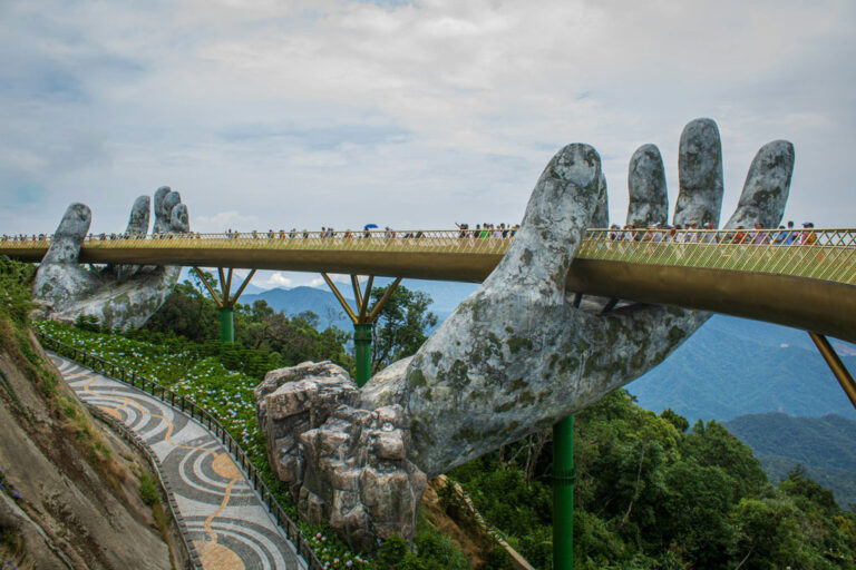 Photo of Golden Bridge in Vietnam with sculpture of two hands supporting the bridge. Credit: Khải Đồng