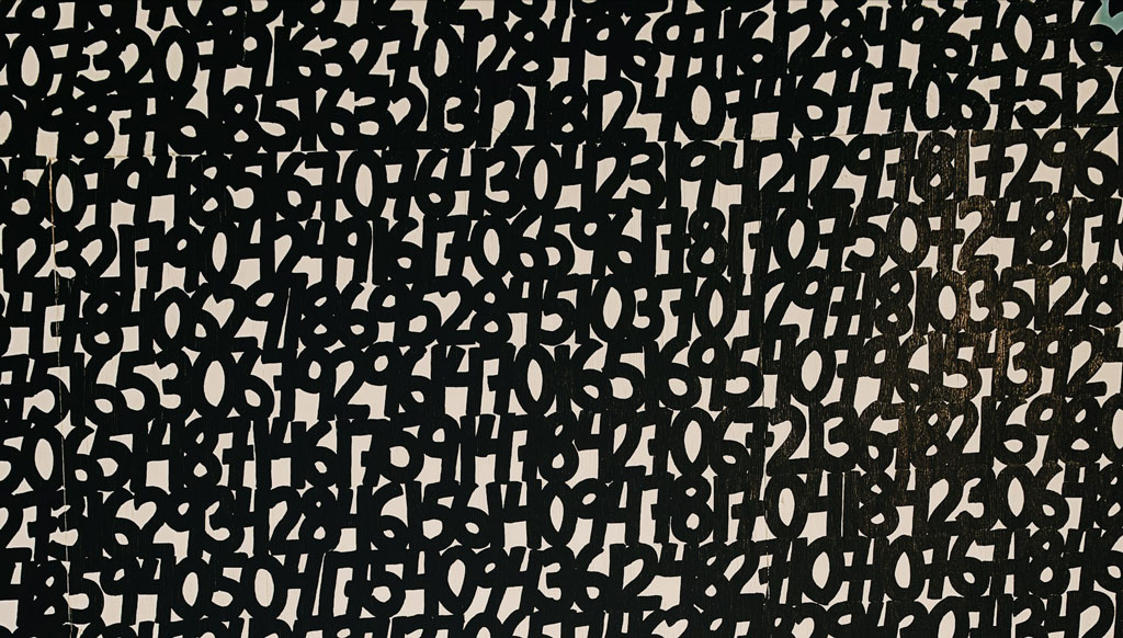 Jumble of white numbers on a black background