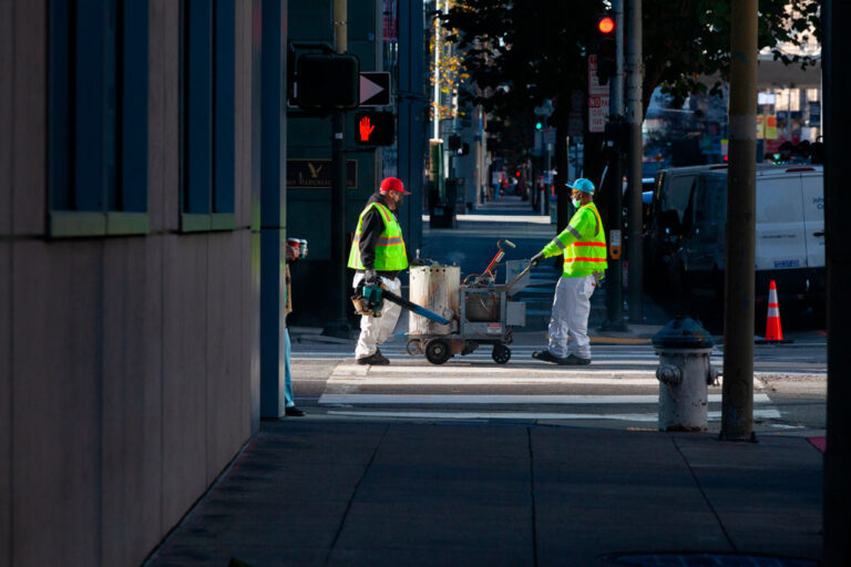 Two city workers on road repair project in San Francisco
