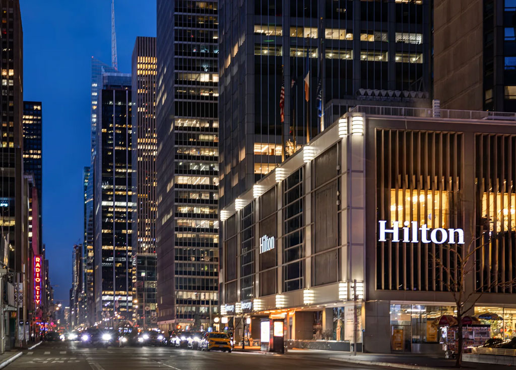 Image of Hilton Midtown hotel across from Radio City Music Hall in New York City at dusk. Credit: Scott Baker
