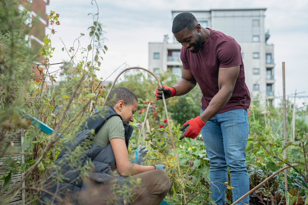 Couple working in urban garden