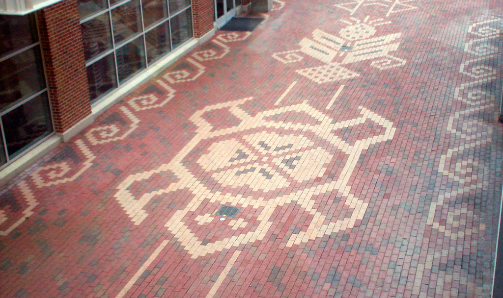 Tan and red brick mosaic walkway on the UNC campus.